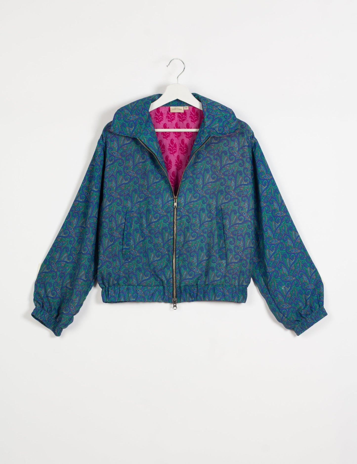 Stylish BOMBER JACKET, an upcycled clothing masterpiece with a cute cropped shape, elasticated details, and detachable metallic zipper. Contrast sari print lining adds a unique touch. Explore sustainable and eco-friendly fashion.