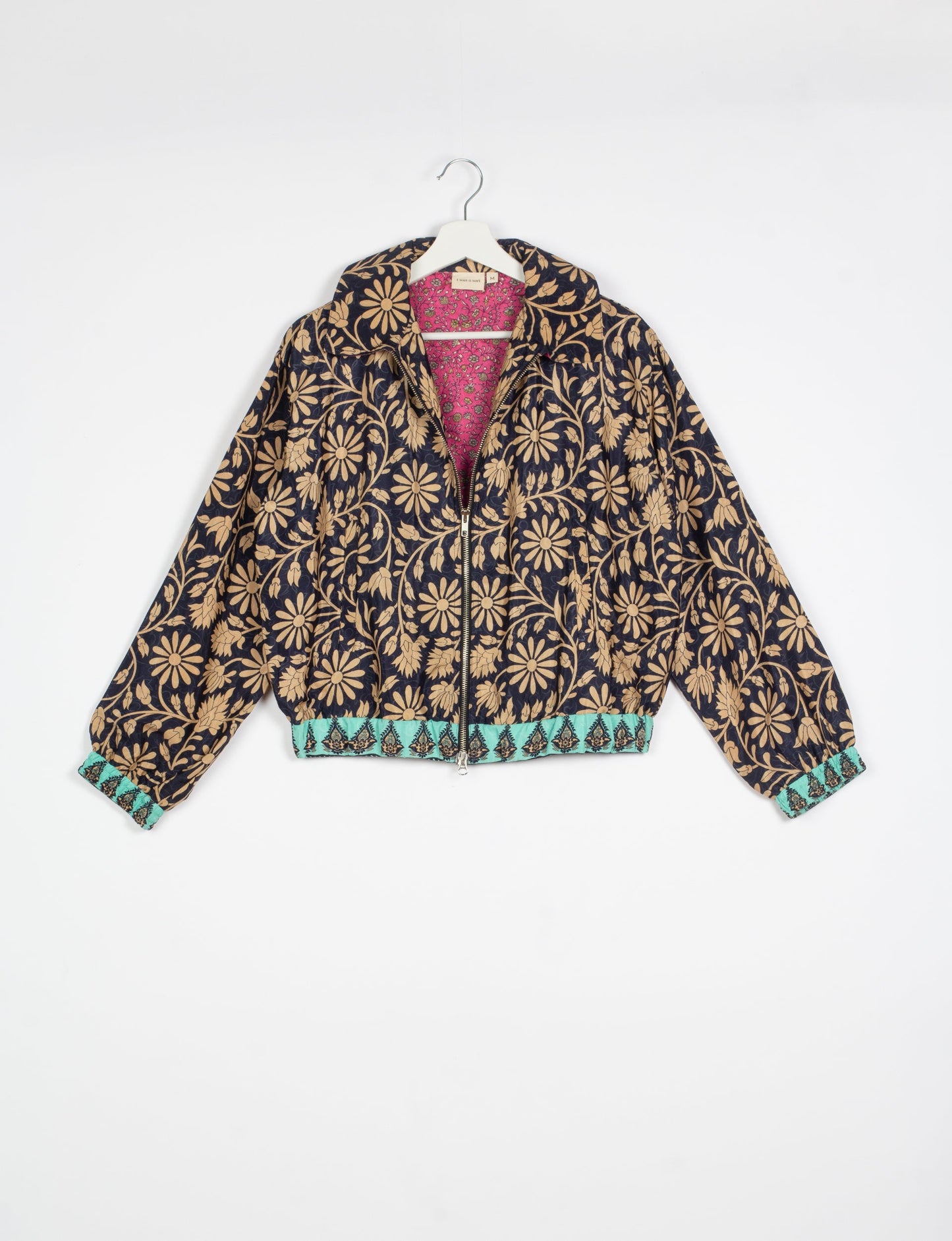 Stylish BOMBER JACKET, an upcycled clothing masterpiece with a cute cropped shape, elasticated details, and detachable metallic zipper. Contrast sari print lining adds a unique touch. Explore sustainable and eco-friendly fashion.