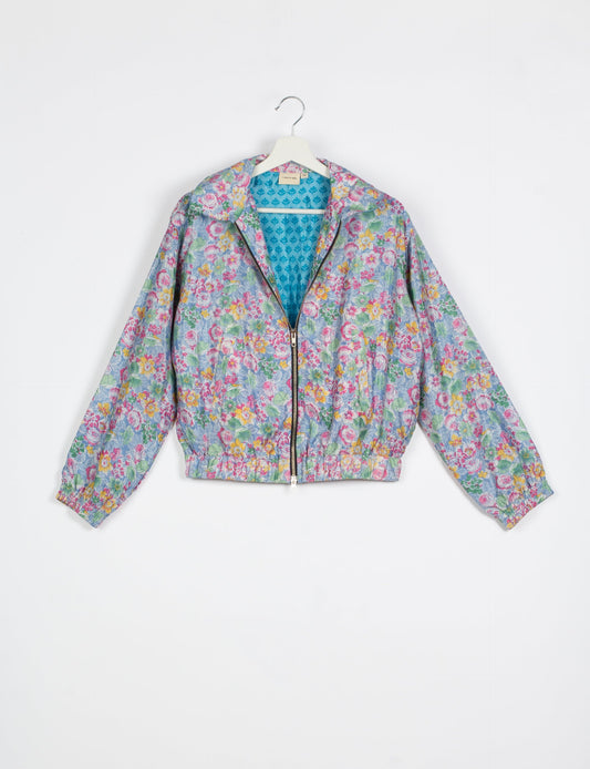 Stylish BOMBER JACKET, an upcycled clothing masterpiece with a cute cropped shape, elasticated details, and detachable metallic zipper. Contrast sari print lining adds a unique touch. Explore sustainable and eco-friendly fashion.