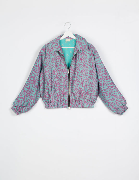 Stylish BOMBER JACKET, an upcycled clothing masterpiece with a cute cropped shape, elasticated details, and detachable metallic zipper. Contrast sari print lining adds a unique touch. Explore sustainable and eco-friendly fashion.