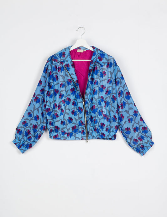 Stylish BOMBER JACKET, an upcycled clothing masterpiece with a cute cropped shape, elasticated details, and detachable metallic zipper. Contrast sari print lining adds a unique touch. Explore sustainable and eco-friendly fashion.