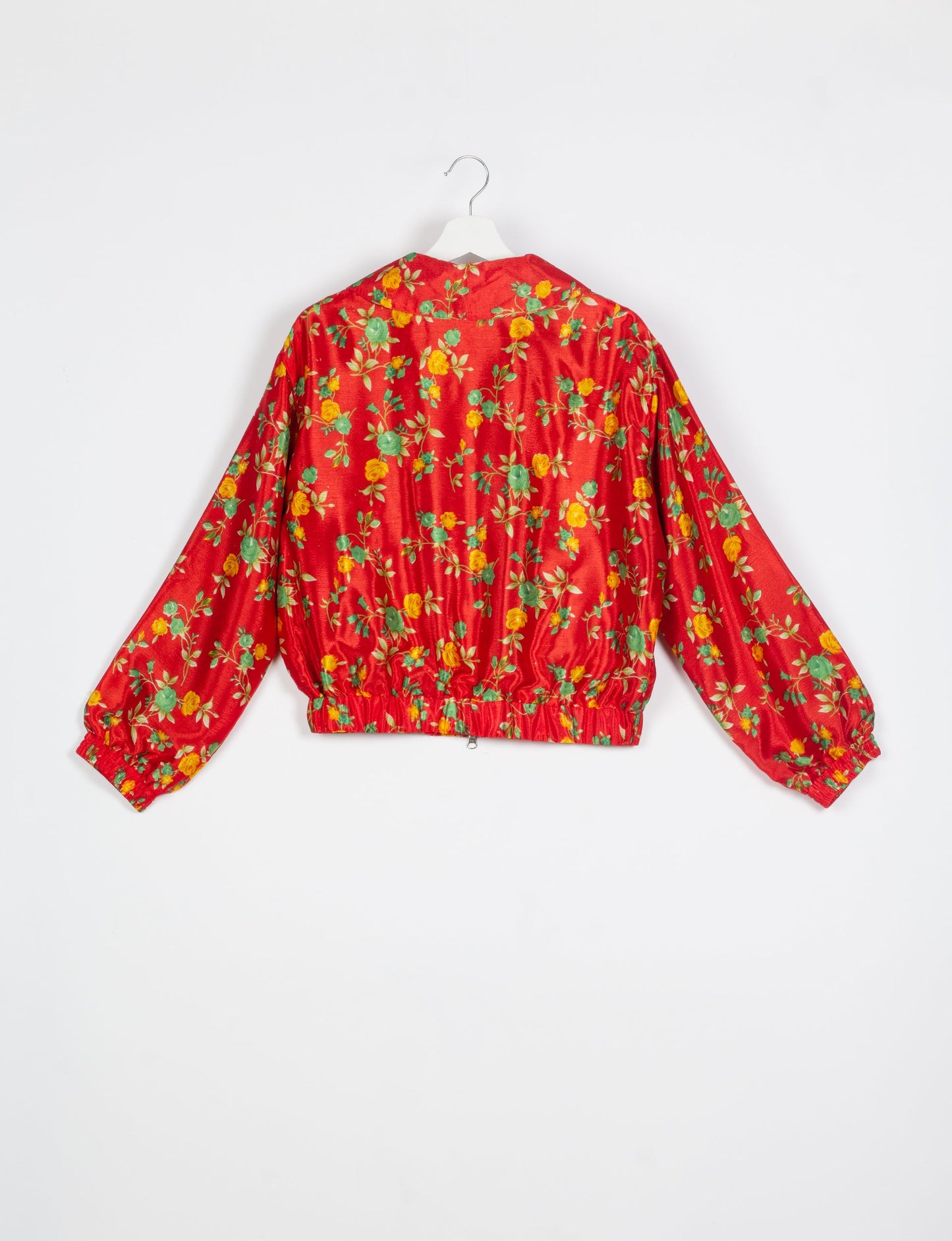 Stylish BOMBER JACKET, an upcycled clothing masterpiece with a cute cropped shape, elasticated details, and detachable metallic zipper. Contrast sari print lining adds a unique touch. Explore sustainable and eco-friendly fashion.