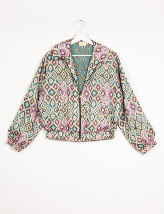 Stylish BOMBER JACKET, an upcycled clothing masterpiece with a cute cropped shape, elasticated details, and detachable metallic zipper. Contrast sari print lining adds a unique touch. Explore sustainable and eco-friendly fashion.