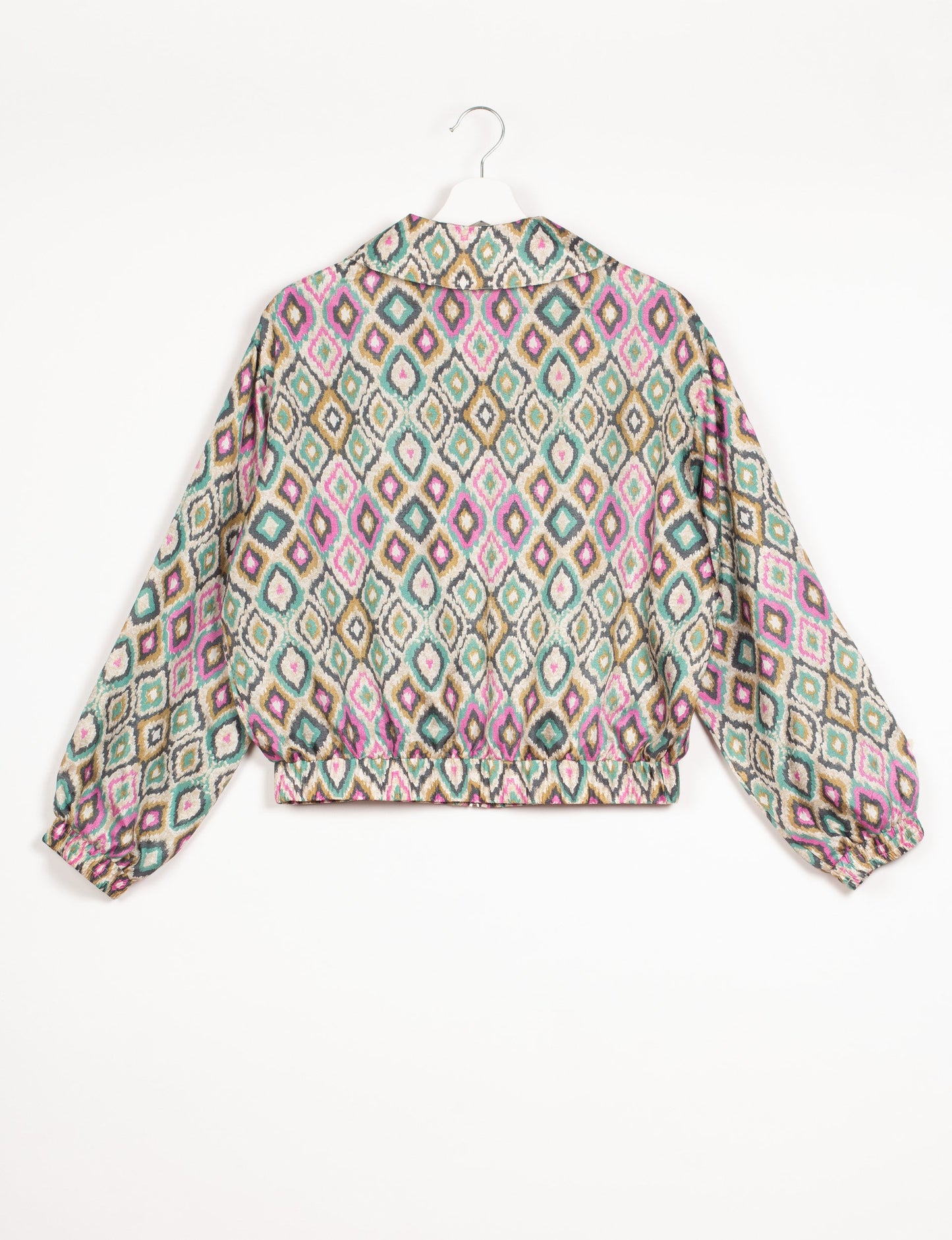 Stylish BOMBER JACKET, an upcycled clothing masterpiece with a cute cropped shape, elasticated details, and detachable metallic zipper. Contrast sari print lining adds a unique touch. Explore sustainable and eco-friendly fashion.