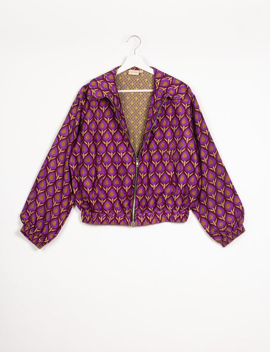 Stylish BOMBER JACKET, an upcycled clothing masterpiece with a cute cropped shape, elasticated details, and detachable metallic zipper. Contrast sari print lining adds a unique touch. Explore sustainable and eco-friendly fashion.