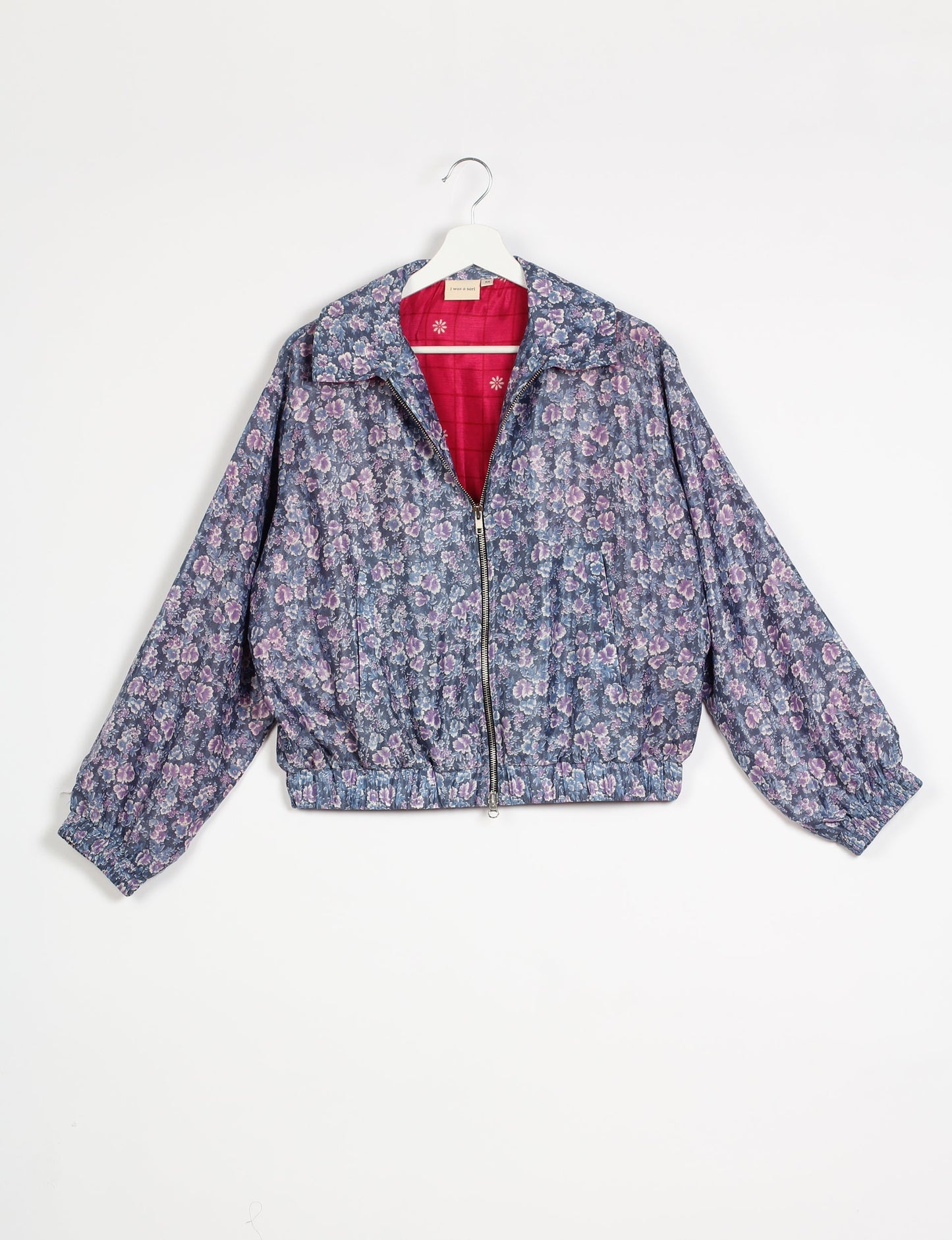 Stylish BOMBER JACKET, an upcycled clothing masterpiece with a cute cropped shape, elasticated details, and detachable metallic zipper. Contrast sari print lining adds a unique touch. Explore sustainable and eco-friendly fashion.