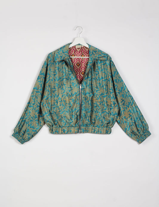 Stylish BOMBER JACKET, an upcycled clothing masterpiece with a cute cropped shape, elasticated details, and detachable metallic zipper. Contrast sari print lining adds a unique touch. Explore sustainable and eco-friendly fashion.