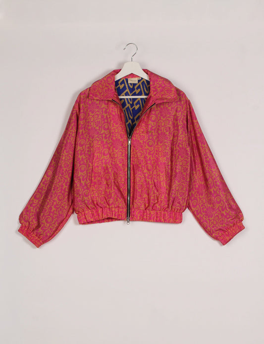 Stylish BOMBER JACKET, an upcycled clothing masterpiece with a cute cropped shape, elasticated details, and detachable metallic zipper. Contrast sari print lining adds a unique touch. Explore sustainable and eco-friendly fashion.