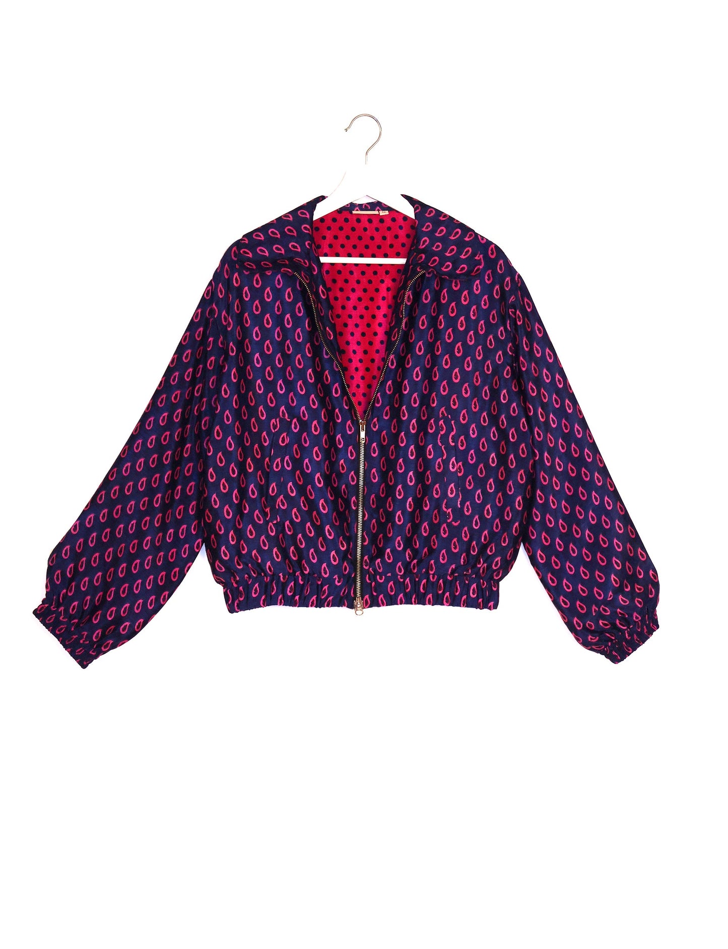 Stylish BOMBER JACKET, an upcycled clothing masterpiece with a cute cropped shape, elasticated details, and detachable metallic zipper. Contrast sari print lining adds a unique touch. Explore sustainable and eco-friendly fashion.