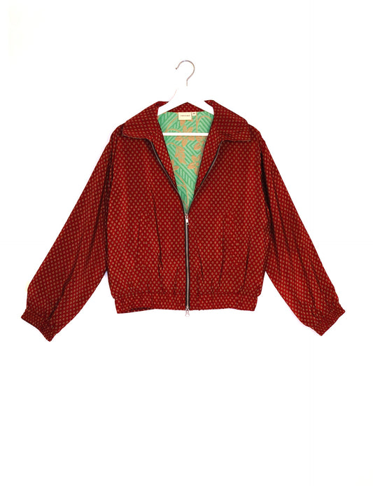 Stylish BOMBER JACKET, an upcycled clothing masterpiece with a cute cropped shape, elasticated details, and detachable metallic zipper. Contrast sari print lining adds a unique touch. Explore sustainable and eco-friendly fashion.