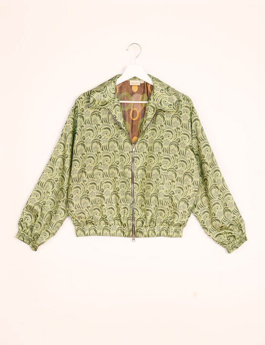 Stylish BOMBER JACKET, an upcycled clothing masterpiece with a cute cropped shape, elasticated details, and detachable metallic zipper. Contrast sari print lining adds a unique touch. Explore sustainable and eco-friendly fashion.