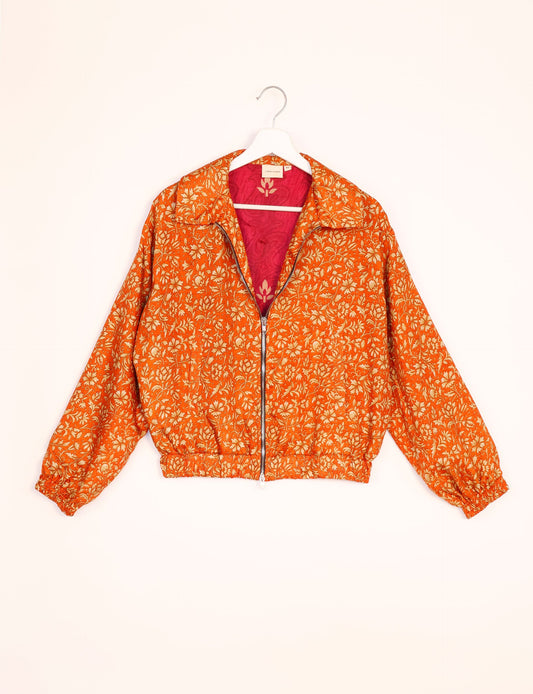 Stylish BOMBER JACKET, an upcycled clothing masterpiece with a cute cropped shape, elasticated details, and detachable metallic zipper. Contrast sari print lining adds a unique touch. Explore sustainable and eco-friendly fashion.