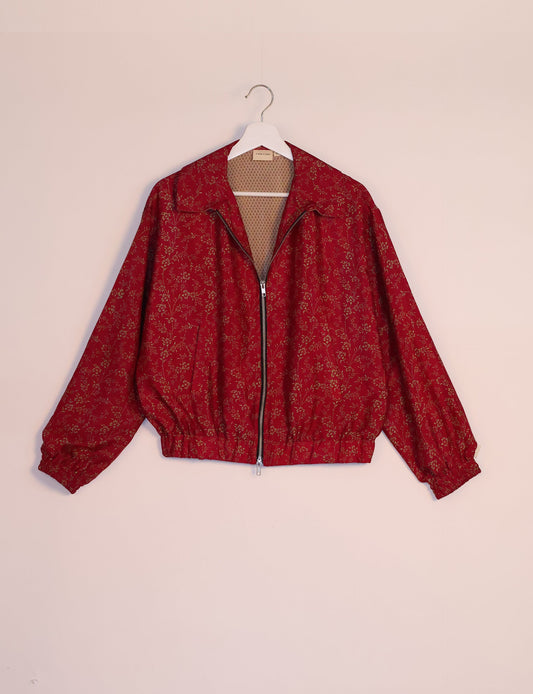 Stylish BOMBER JACKET, an upcycled clothing masterpiece with a cute cropped shape, elasticated details, and detachable metallic zipper. Contrast sari print lining adds a unique touch. Explore sustainable and eco-friendly fashion.