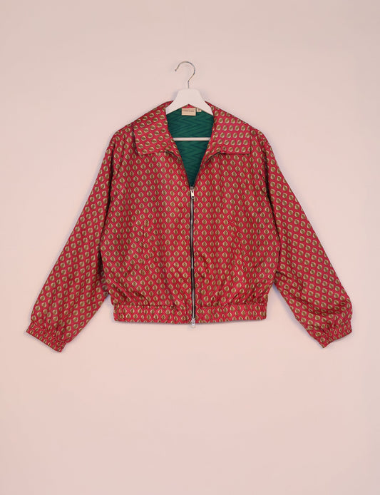 Stylish BOMBER JACKET, an upcycled clothing masterpiece with a cute cropped shape, elasticated details, and detachable metallic zipper. Contrast sari print lining adds a unique touch. Explore sustainable and eco-friendly fashion.