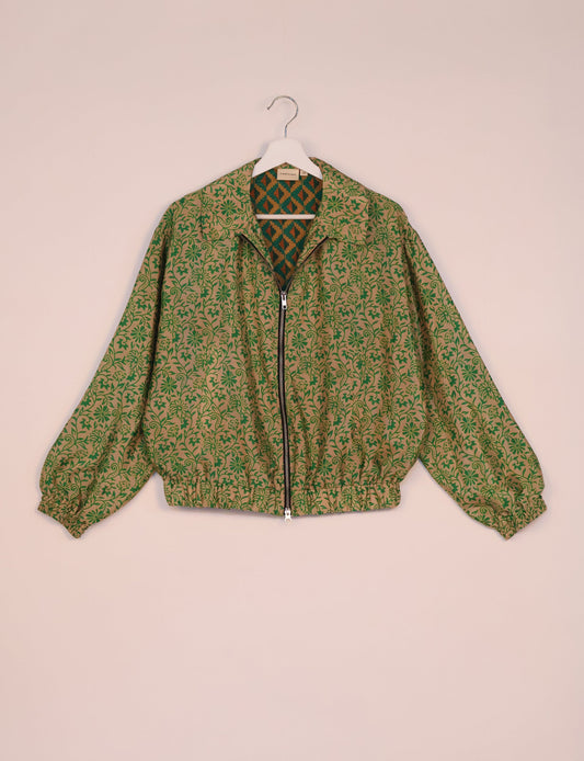 Stylish BOMBER JACKET, an upcycled clothing masterpiece with a cute cropped shape, elasticated details, and detachable metallic zipper. Contrast sari print lining adds a unique touch. Explore sustainable and eco-friendly fashion.