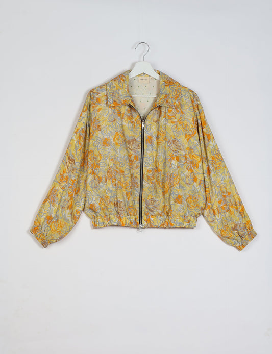 Stylish BOMBER JACKET, an upcycled clothing masterpiece with a cute cropped shape, elasticated details, and detachable metallic zipper. Contrast sari print lining adds a unique touch. Explore sustainable and eco-friendly fashion.