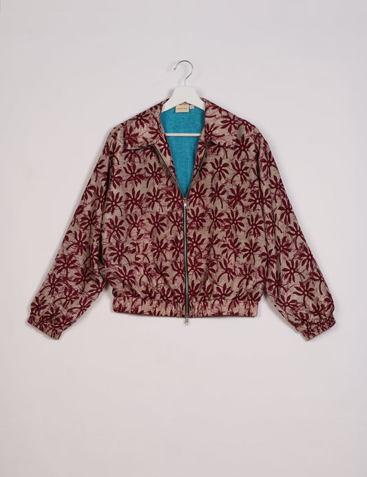 Stylish BOMBER JACKET, an upcycled clothing masterpiece with a cute cropped shape, elasticated details, and detachable metallic zipper. Contrast sari print lining adds a unique touch. Explore sustainable and eco-friendly fashion.