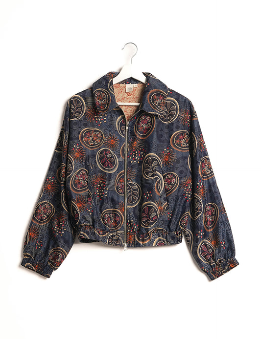 Stylish BOMBER JACKET, an upcycled clothing masterpiece with a cute cropped shape, elasticated details, and detachable metallic zipper. Contrast sari print lining adds a unique touch. Explore sustainable and eco-friendly fashion.