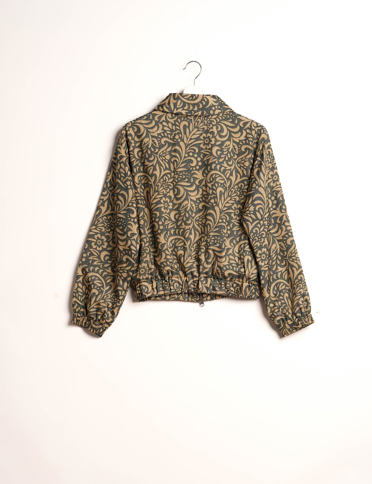 Stylish BOMBER JACKET, an upcycled clothing masterpiece with a cute cropped shape, elasticated details, and detachable metallic zipper. Contrast sari print lining adds a unique touch. Explore sustainable and eco-friendly fashion.