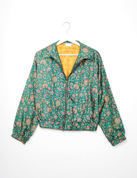 Stylish BOMBER JACKET, an upcycled clothing masterpiece with a cute cropped shape, elasticated details, and detachable metallic zipper. Contrast sari print lining adds a unique touch. Explore sustainable and eco-friendly fashion.