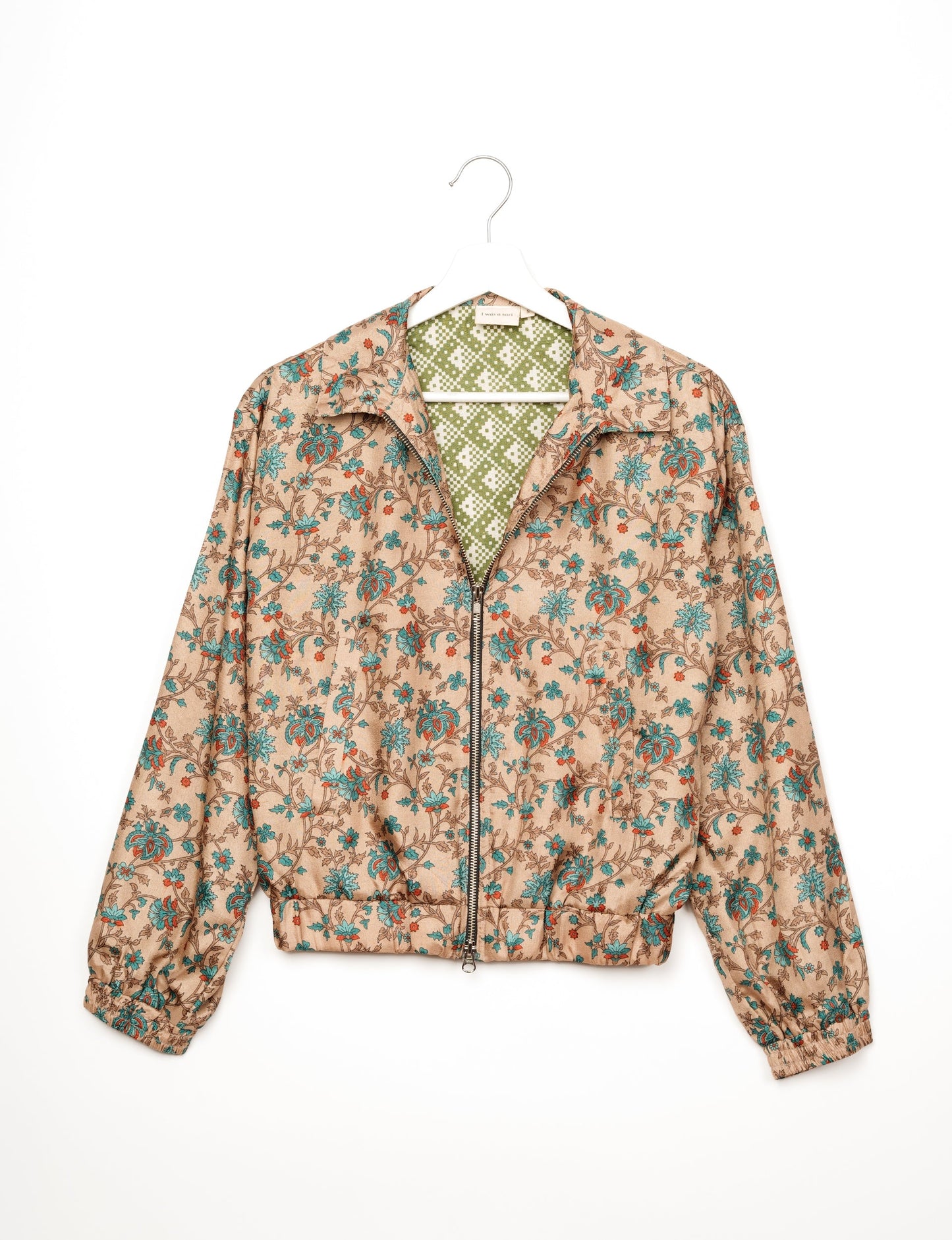 Stylish BOMBER JACKET, an upcycled clothing masterpiece with a cute cropped shape, elasticated details, and detachable metallic zipper. Contrast sari print lining adds a unique touch. Explore sustainable and eco-friendly fashion.