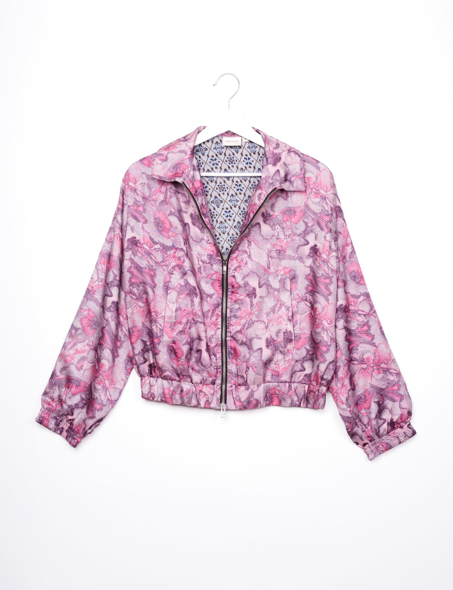 Stylish BOMBER JACKET, an upcycled clothing masterpiece with a cute cropped shape, elasticated details, and detachable metallic zipper. Contrast sari print lining adds a unique touch. Explore sustainable and eco-friendly fashion.