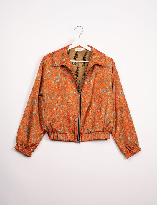 Stylish BOMBER JACKET, an upcycled clothing masterpiece with a cute cropped shape, elasticated details, and detachable metallic zipper. Contrast sari print lining adds a unique touch. Explore sustainable and eco-friendly fashion.