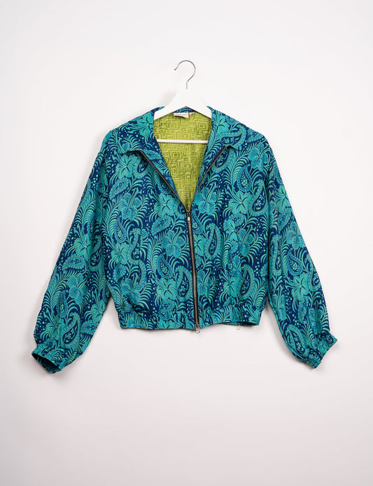 Stylish BOMBER JACKET, an upcycled clothing masterpiece with a cute cropped shape, elasticated details, and detachable metallic zipper. Contrast sari print lining adds a unique touch. Explore sustainable and eco-friendly fashion.