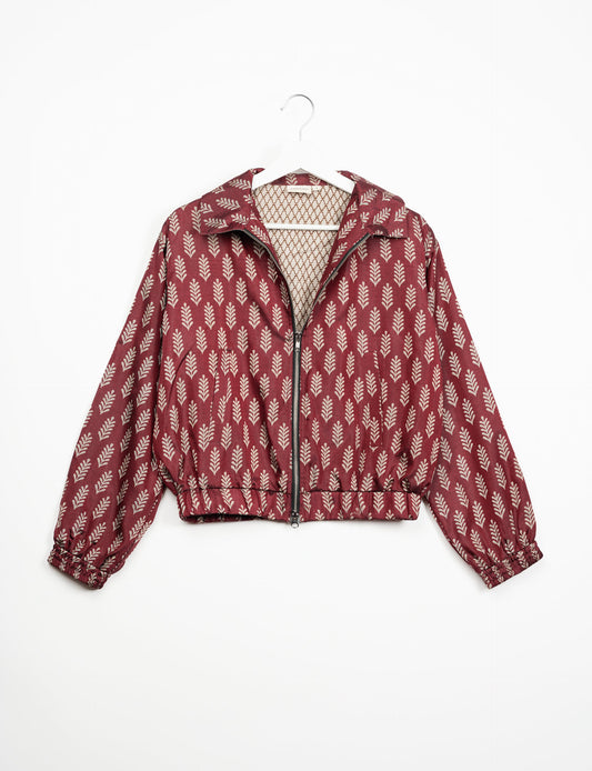 Stylish BOMBER JACKET, an upcycled clothing masterpiece with a cute cropped shape, elasticated details, and detachable metallic zipper. Contrast sari print lining adds a unique touch. Explore sustainable and eco-friendly fashion.