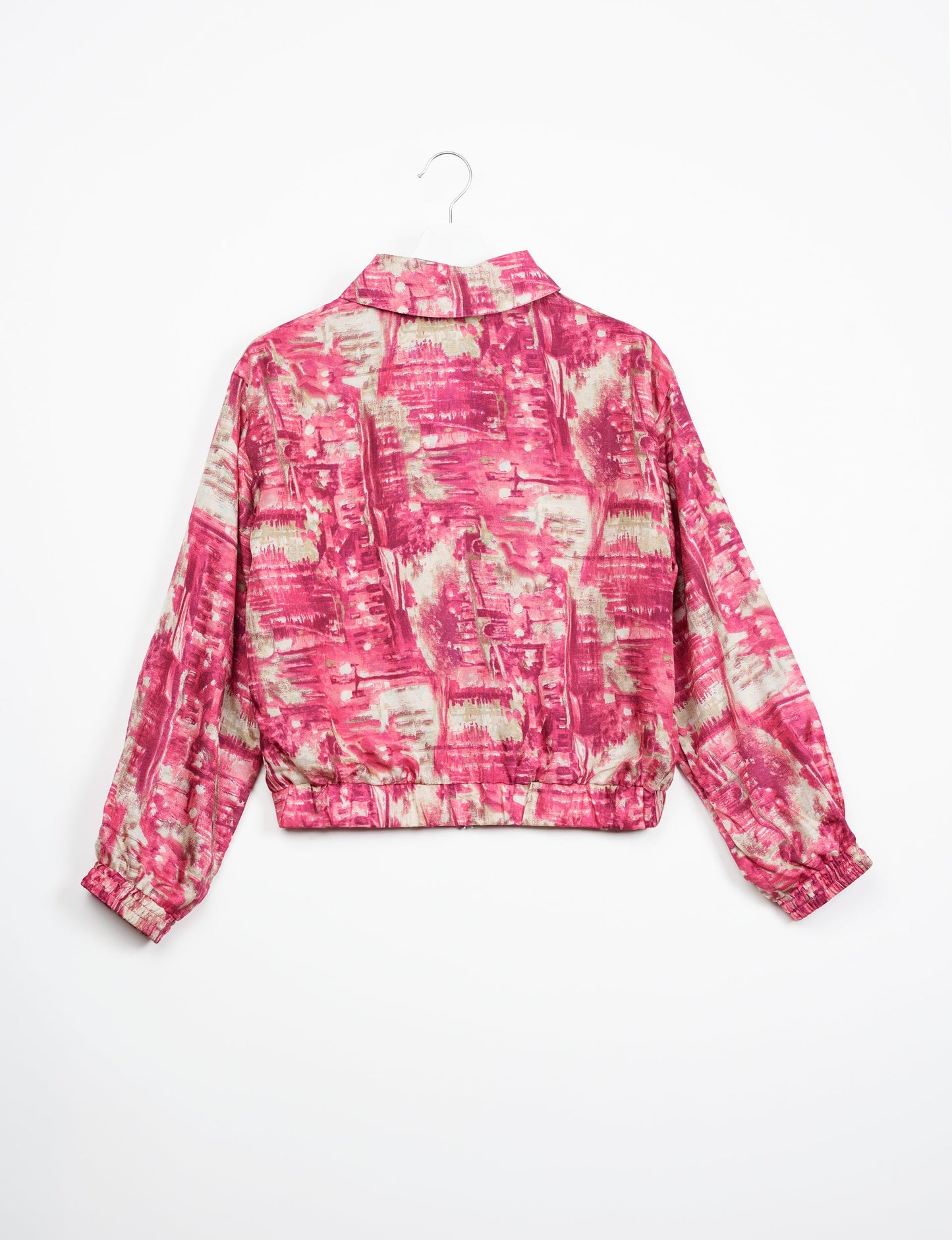 Stylish BOMBER JACKET, an upcycled clothing masterpiece with a cute cropped shape, elasticated details, and detachable metallic zipper. Contrast sari print lining adds a unique touch. Explore sustainable and eco-friendly fashion.