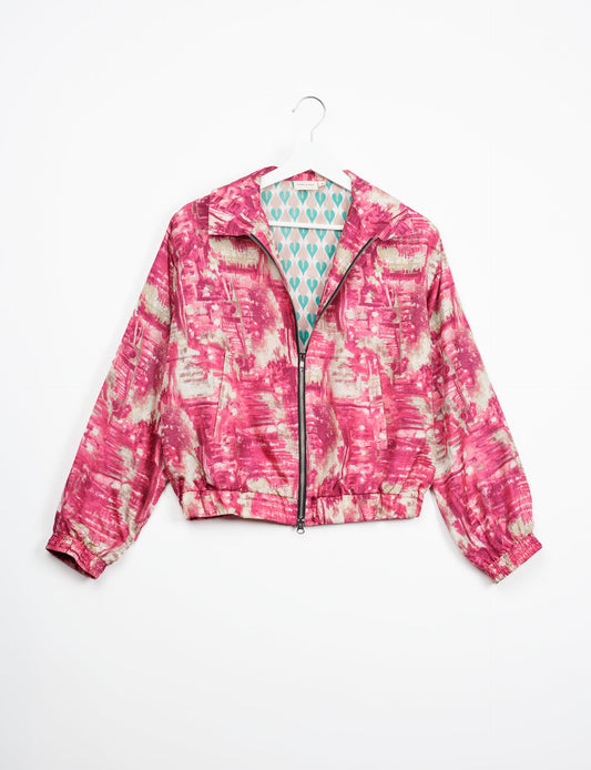 Stylish BOMBER JACKET, an upcycled clothing masterpiece with a cute cropped shape, elasticated details, and detachable metallic zipper. Contrast sari print lining adds a unique touch. Explore sustainable and eco-friendly fashion.