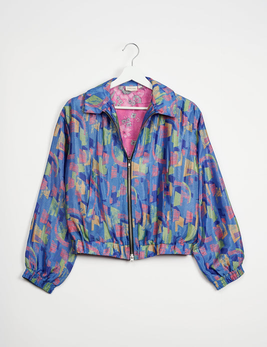 Stylish BOMBER JACKET, an upcycled clothing masterpiece with a cute cropped shape, elasticated details, and detachable metallic zipper. Contrast sari print lining adds a unique touch. Explore sustainable and eco-friendly fashion.