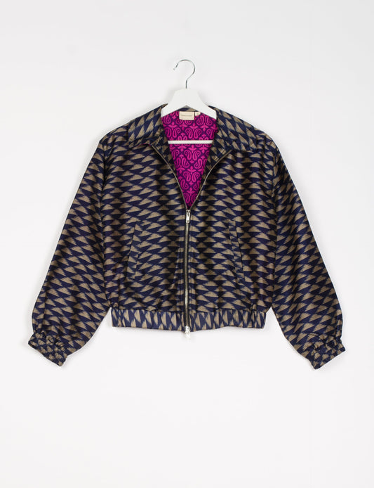 Stylish BOMBER JACKET, an upcycled clothing masterpiece with a cute cropped shape, elasticated details, and detachable metallic zipper. Contrast sari print lining adds a unique touch. Explore sustainable and eco-friendly fashion.