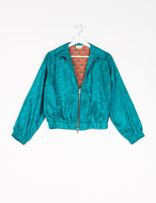 Stylish BOMBER JACKET, an upcycled clothing masterpiece with a cute cropped shape, elasticated details, and detachable metallic zipper. Contrast sari print lining adds a unique touch. Explore sustainable and eco-friendly fashion.