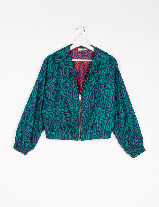 Stylish BOMBER JACKET, an upcycled clothing masterpiece with a cute cropped shape, elasticated details, and detachable metallic zipper. Contrast sari print lining adds a unique touch. Explore sustainable and eco-friendly fashion.