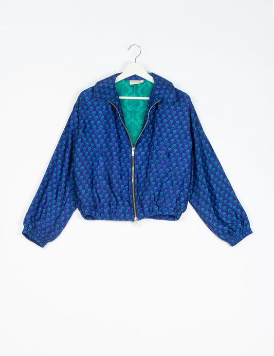 Stylish BOMBER JACKET, an upcycled clothing masterpiece with a cute cropped shape, elasticated details, and detachable metallic zipper. Contrast sari print lining adds a unique touch. Explore sustainable and eco-friendly fashion.