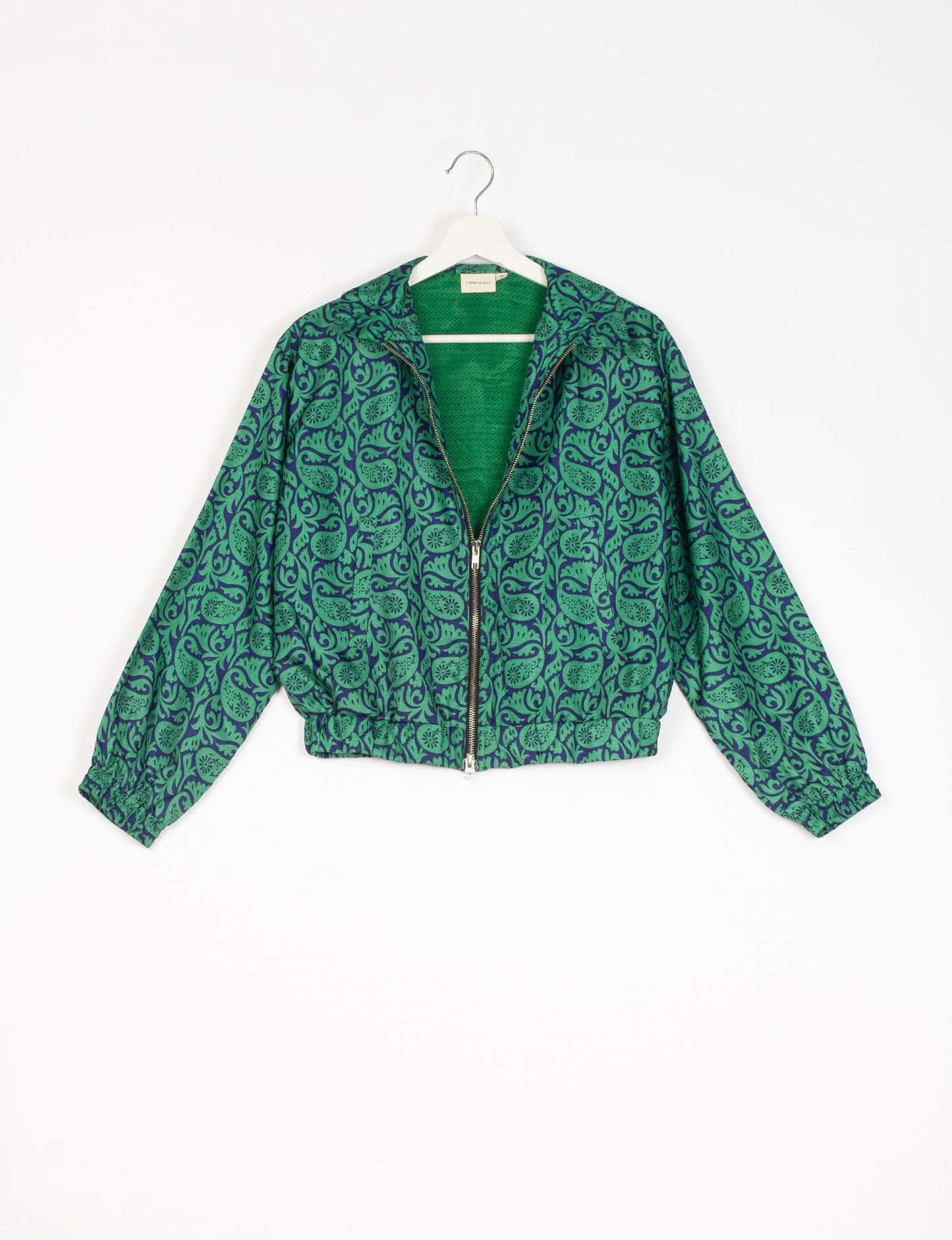 Stylish BOMBER JACKET, an upcycled clothing masterpiece with a cute cropped shape, elasticated details, and detachable metallic zipper. Contrast sari print lining adds a unique touch. Explore sustainable and eco-friendly fashion.