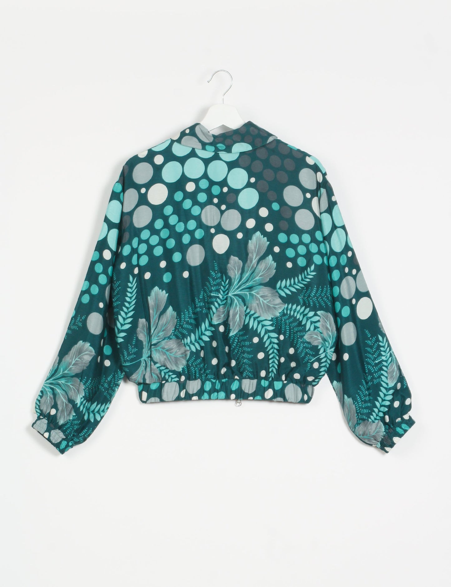 Stylish BOMBER JACKET, an upcycled clothing masterpiece with a cute cropped shape, elasticated details, and detachable metallic zipper. Contrast sari print lining adds a unique touch. Explore sustainable and eco-friendly fashion.