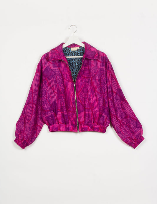 Stylish BOMBER JACKET, an upcycled clothing masterpiece with a cute cropped shape, elasticated details, and detachable metallic zipper. Contrast sari print lining adds a unique touch. Explore sustainable and eco-friendly fashion.