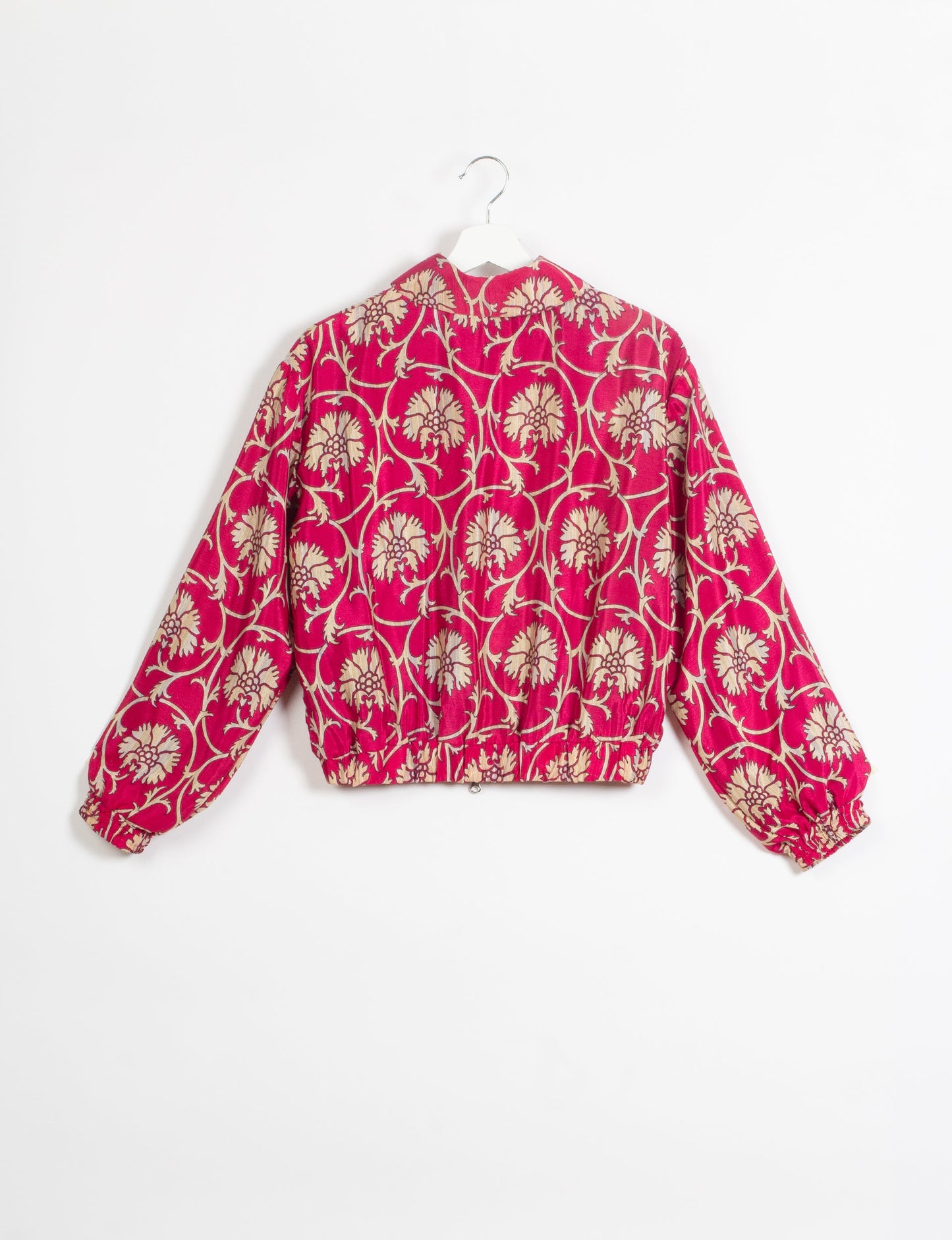 Stylish BOMBER JACKET, an upcycled clothing masterpiece with a cute cropped shape, elasticated details, and detachable metallic zipper. Contrast sari print lining adds a unique touch. Explore sustainable and eco-friendly fashion.