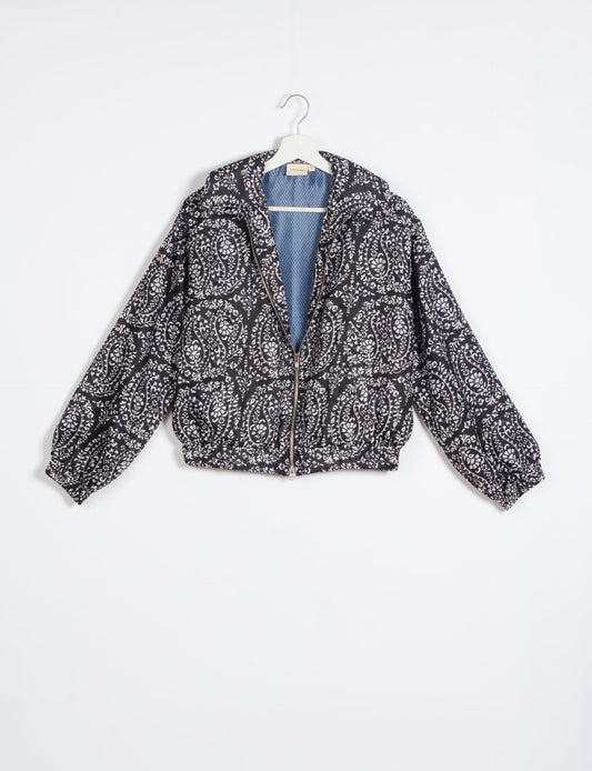 Stylish BOMBER JACKET, an upcycled clothing masterpiece with a cute cropped shape, elasticated details, and detachable metallic zipper. Contrast sari print lining adds a unique touch. Explore sustainable and eco-friendly fashion.