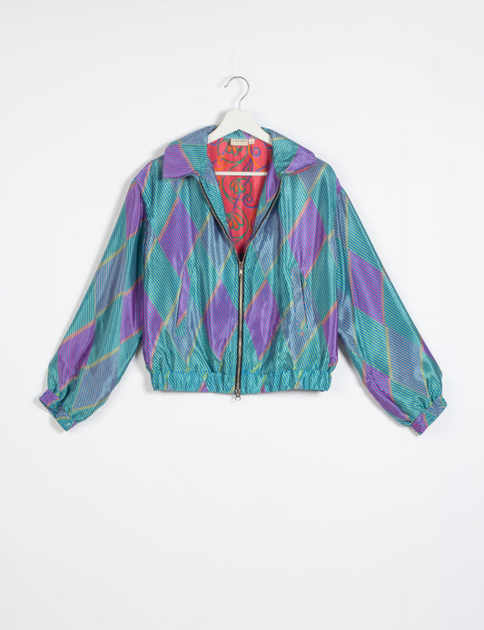 Stylish BOMBER JACKET, an upcycled clothing masterpiece with a cute cropped shape, elasticated details, and detachable metallic zipper. Contrast sari print lining adds a unique touch. Explore sustainable and eco-friendly fashion.