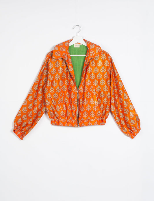 Stylish BOMBER JACKET, an upcycled clothing masterpiece with a cute cropped shape, elasticated details, and detachable metallic zipper. Contrast sari print lining adds a unique touch. Explore sustainable and eco-friendly fashion.