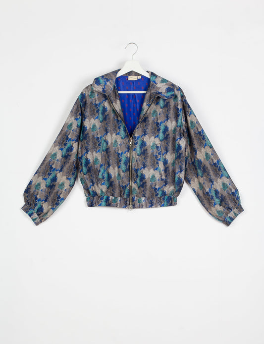 Stylish BOMBER JACKET, an upcycled clothing masterpiece with a cute cropped shape, elasticated details, and detachable metallic zipper. Contrast sari print lining adds a unique touch. Explore sustainable and eco-friendly fashion.