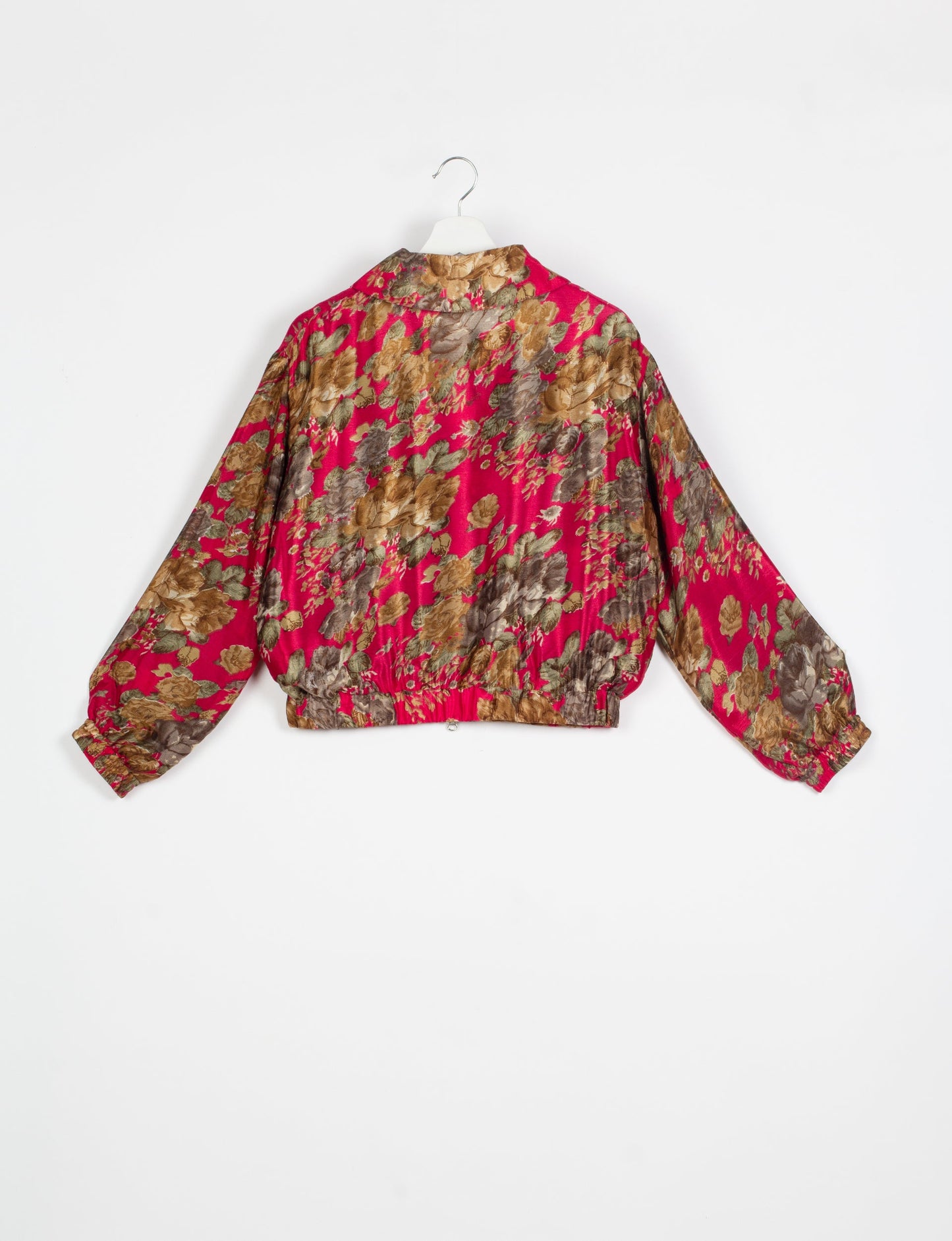 Stylish BOMBER JACKET, an upcycled clothing masterpiece with a cute cropped shape, elasticated details, and detachable metallic zipper. Contrast sari print lining adds a unique touch. Explore sustainable and eco-friendly fashion.