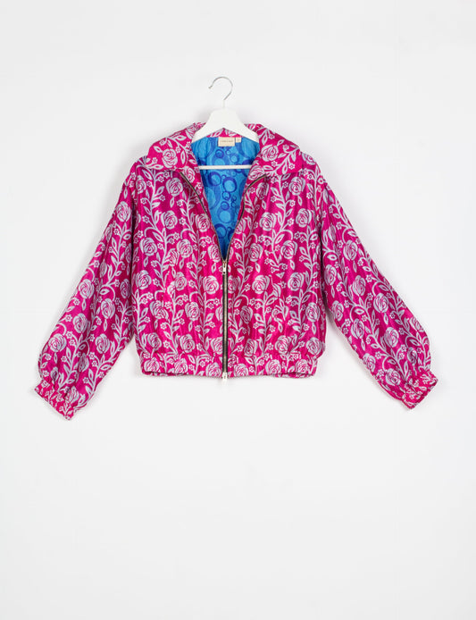 Stylish BOMBER JACKET, an upcycled clothing masterpiece with a cute cropped shape, elasticated details, and detachable metallic zipper. Contrast sari print lining adds a unique touch. Explore sustainable and eco-friendly fashion.