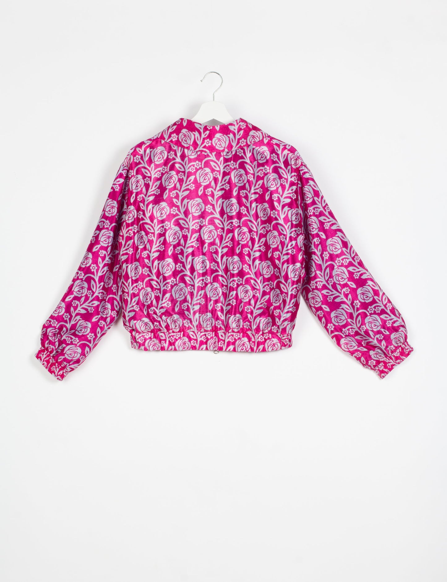 Stylish BOMBER JACKET, an upcycled clothing masterpiece with a cute cropped shape, elasticated details, and detachable metallic zipper. Contrast sari print lining adds a unique touch. Explore sustainable and eco-friendly fashion.