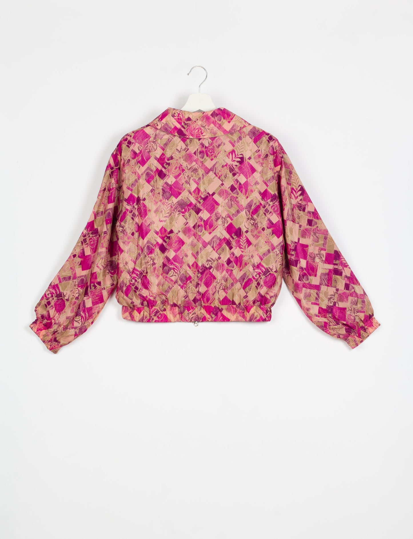 Stylish BOMBER JACKET, an upcycled clothing masterpiece with a cute cropped shape, elasticated details, and detachable metallic zipper. Contrast sari print lining adds a unique touch. Explore sustainable and eco-friendly fashion.