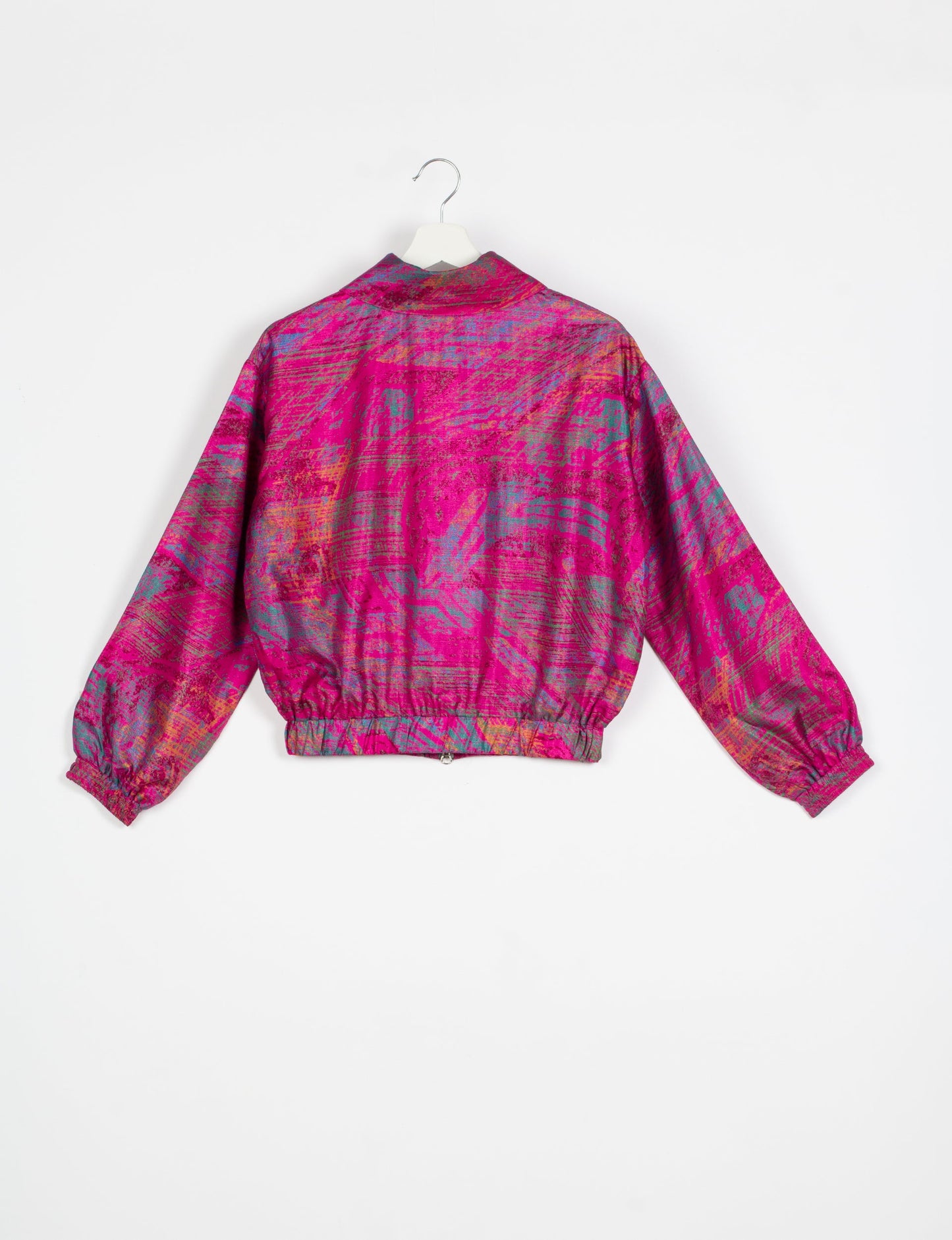 Stylish BOMBER JACKET, an upcycled clothing masterpiece with a cute cropped shape, elasticated details, and detachable metallic zipper. Contrast sari print lining adds a unique touch. Explore sustainable and eco-friendly fashion.