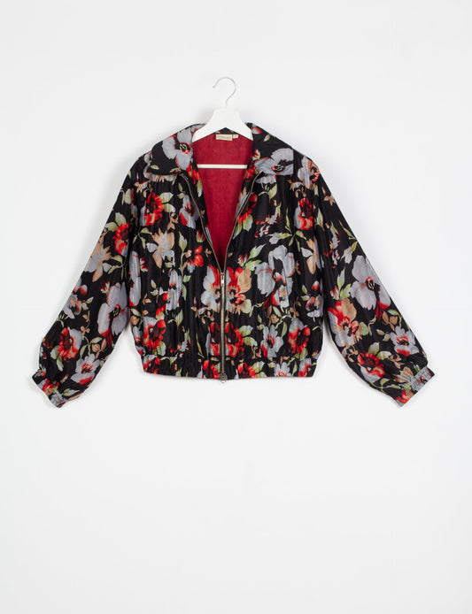 Stylish BOMBER JACKET, an upcycled clothing masterpiece with a cute cropped shape, elasticated details, and detachable metallic zipper. Contrast sari print lining adds a unique touch. Explore sustainable and eco-friendly fashion.